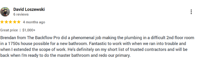 Happy Massachusetts homeowner after plumbing service by The Backflow Pro.